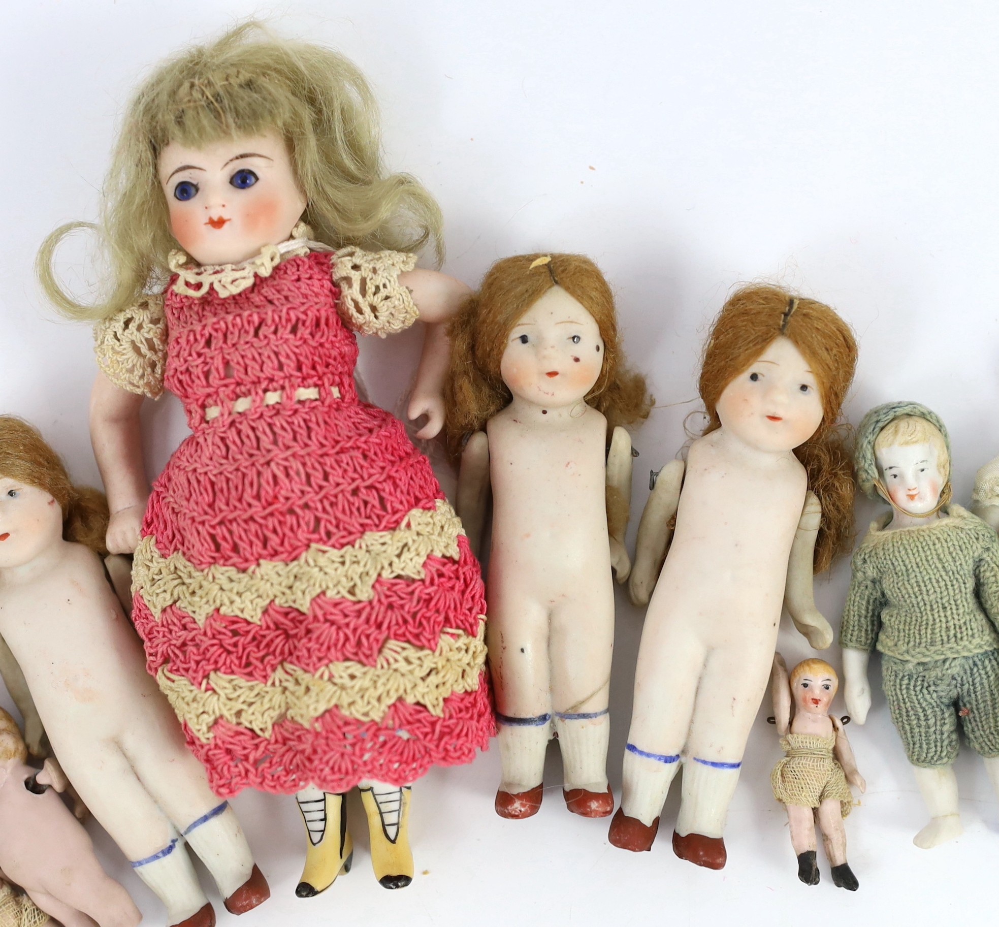 A group of thirteen all-bisque doll’s house dolls, German, early 20th century, tallest 5.5in.